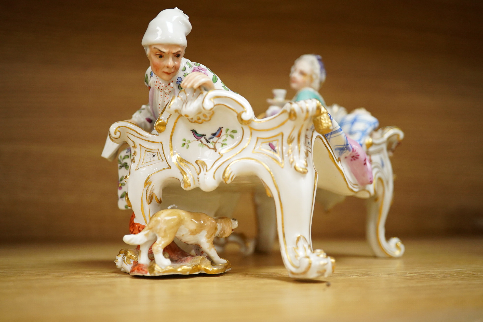 A Meissen style porcelain figure group ‘Discovered Lover’, 19cm wide